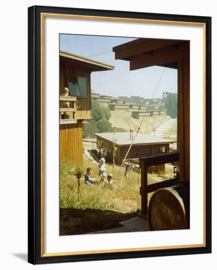 Children Playing in Backyard in Government Housing Project for Bechtel-Managed Shipyards Workers-Andreas Feininger-Framed Premium Photographic Print