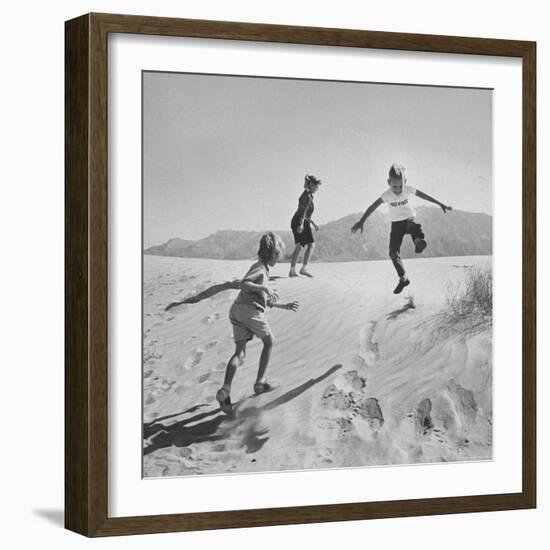 Children Playing in the Desert Sand-Nat Farbman-Framed Photographic Print