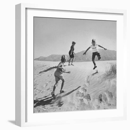 Children Playing in the Desert Sand-Nat Farbman-Framed Photographic Print