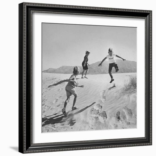 Children Playing in the Desert Sand-Nat Farbman-Framed Photographic Print