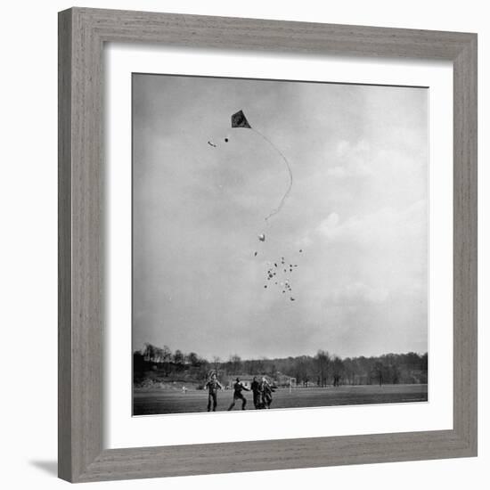 Children Playing with Kite That Releases Toys While in the Air-Bernard Hoffman-Framed Photographic Print