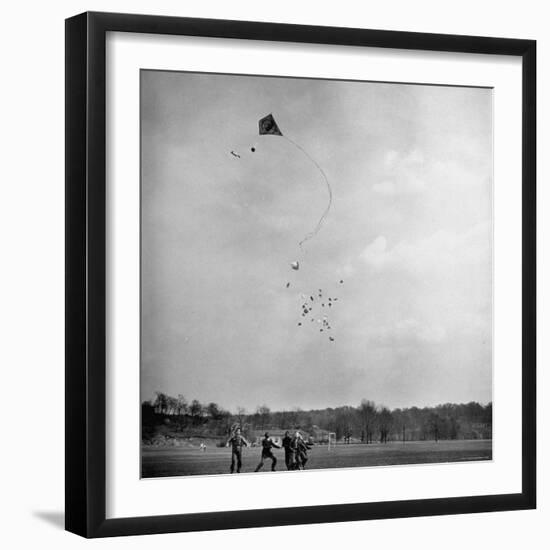 Children Playing with Kite That Releases Toys While in the Air-Bernard Hoffman-Framed Photographic Print