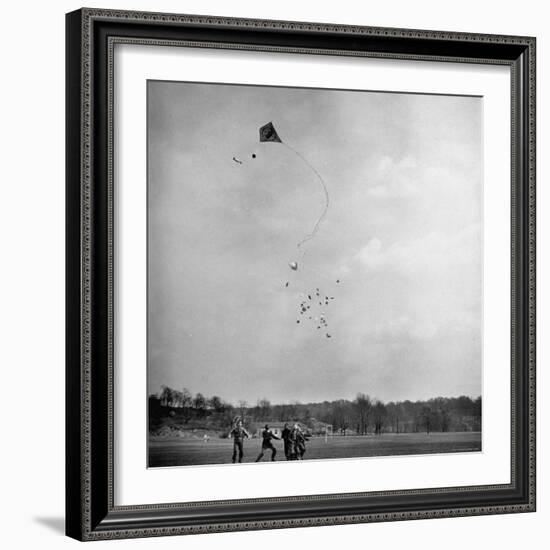 Children Playing with Kite That Releases Toys While in the Air-Bernard Hoffman-Framed Photographic Print