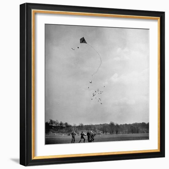 Children Playing with Kite That Releases Toys While in the Air-Bernard Hoffman-Framed Photographic Print