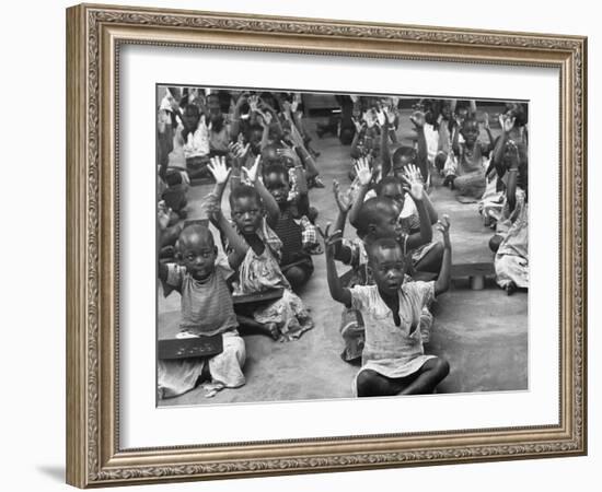 Children Raising their Hands in the Air During Kipuchi Kindergarten Classes-Dmitri Kessel-Framed Photographic Print