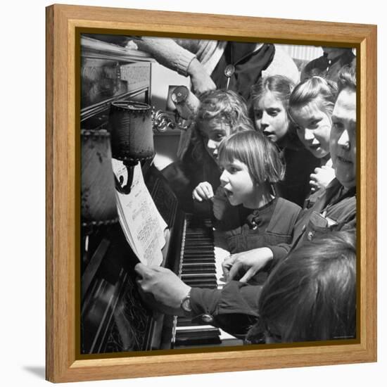 Children Singing Around the Piano at Orphanage-Tony Linck-Framed Premier Image Canvas