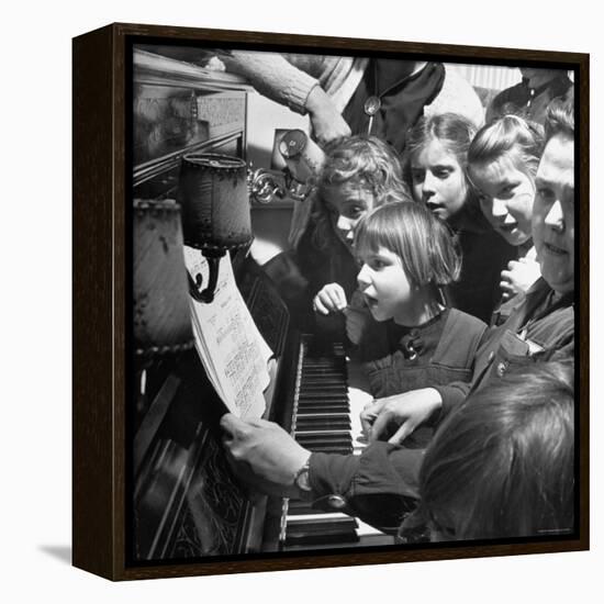 Children Singing Around the Piano at Orphanage-Tony Linck-Framed Premier Image Canvas