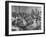 Children Sitting at their Desks in a Classroom, Teachers at the Rear of the Room-null-Framed Photographic Print