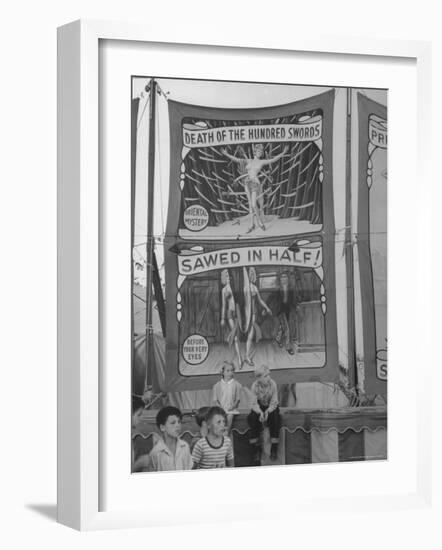 Children Sitting in Front of Banners for Magic Show Being Performed by Orson Welles-Peter Stackpole-Framed Photographic Print