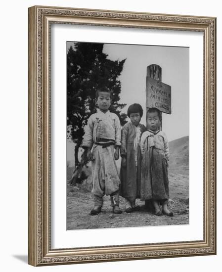 Children Standing in Front of Boundary Zone Sign Written in Russian, English, and Korean-John Florea-Framed Photographic Print