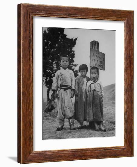 Children Standing in Front of Boundary Zone Sign Written in Russian, English, and Korean-John Florea-Framed Photographic Print