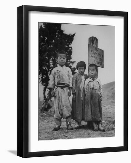 Children Standing in Front of Boundary Zone Sign Written in Russian, English, and Korean-John Florea-Framed Photographic Print