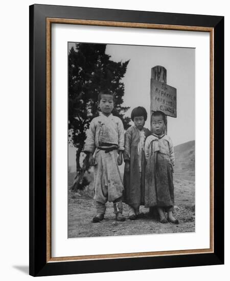 Children Standing in Front of Boundary Zone Sign Written in Russian, English, and Korean-John Florea-Framed Photographic Print