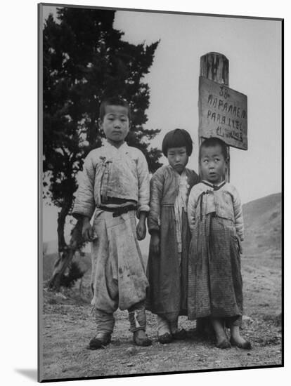 Children Standing in Front of Boundary Zone Sign Written in Russian, English, and Korean-John Florea-Mounted Photographic Print