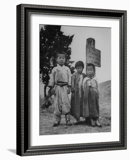 Children Standing in Front of Boundary Zone Sign Written in Russian, English, and Korean-John Florea-Framed Photographic Print