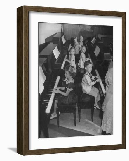 Children Taking Piano Lessons-George Strock-Framed Photographic Print