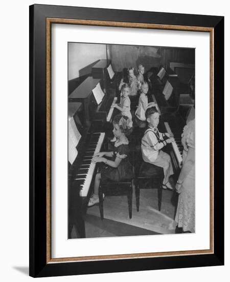 Children Taking Piano Lessons-George Strock-Framed Photographic Print