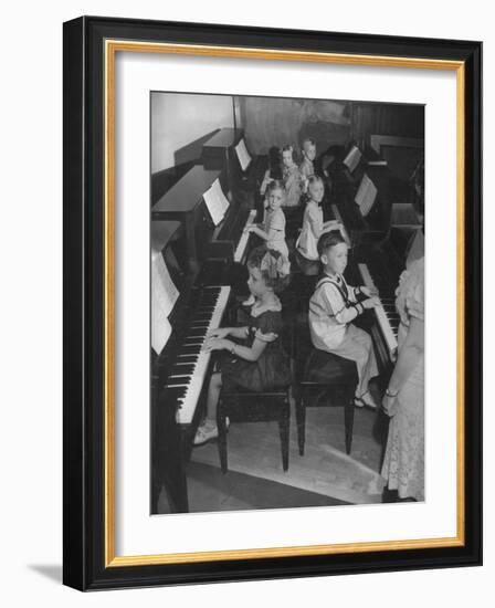 Children Taking Piano Lessons-George Strock-Framed Photographic Print