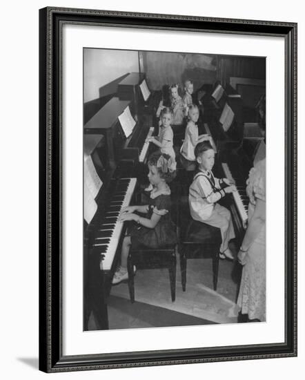 Children Taking Piano Lessons-George Strock-Framed Photographic Print