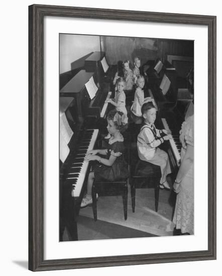 Children Taking Piano Lessons-George Strock-Framed Photographic Print