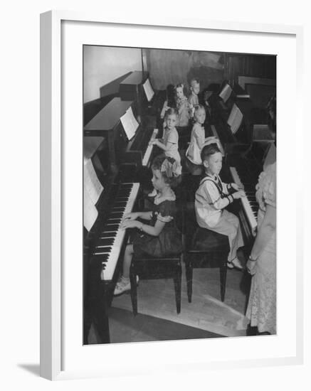 Children Taking Piano Lessons-George Strock-Framed Photographic Print