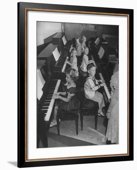 Children Taking Piano Lessons-George Strock-Framed Photographic Print