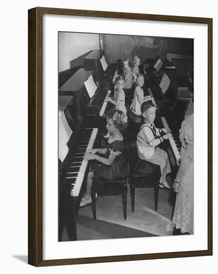 Children Taking Piano Lessons-George Strock-Framed Photographic Print