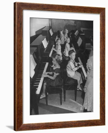Children Taking Piano Lessons-George Strock-Framed Photographic Print