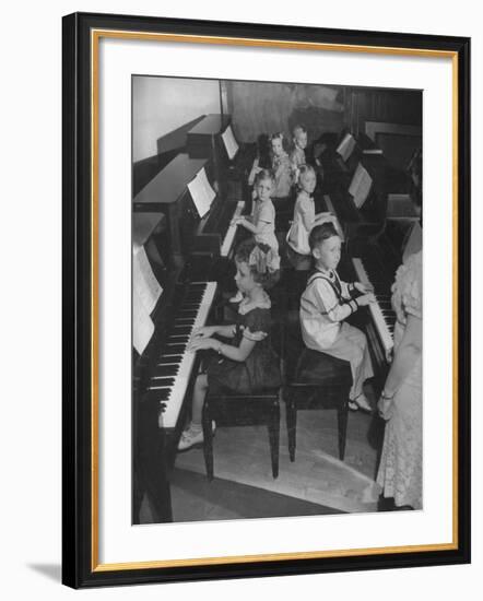 Children Taking Piano Lessons-George Strock-Framed Photographic Print