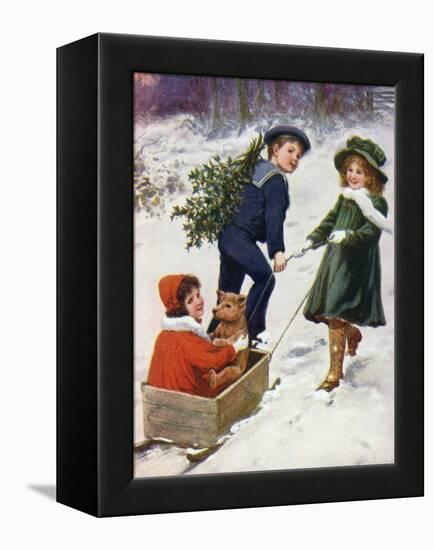 Children Taking Teddy for a Ride across the Snow-null-Framed Stretched Canvas