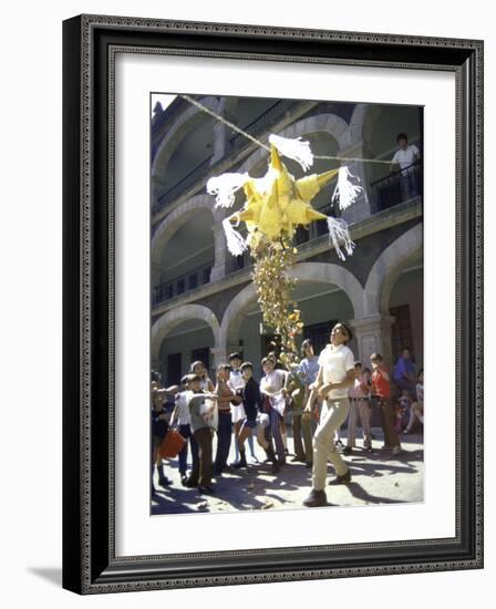 Children Taking Turns Breaking Pinata During Christmas Festival-John Dominis-Framed Photographic Print