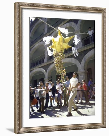 Children Taking Turns Breaking Pinata During Christmas Festival-John Dominis-Framed Photographic Print