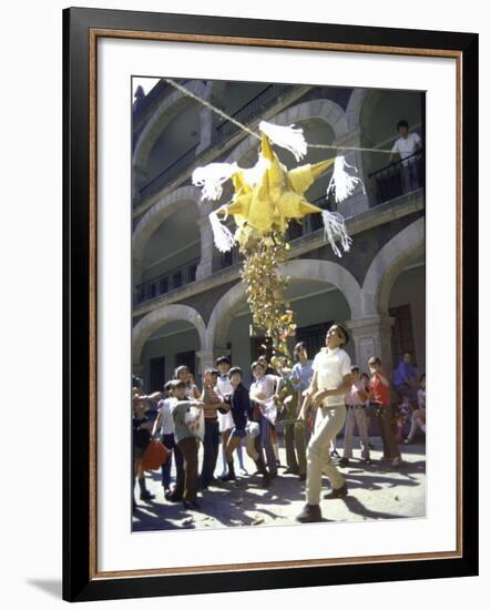 Children Taking Turns Breaking Pinata During Christmas Festival-John Dominis-Framed Photographic Print