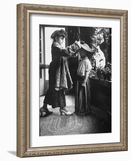 Children Trying on Old Clothes in the Attic, but Little Boy Would Prefer to Be Playing Football-Gordon Parks-Framed Photographic Print