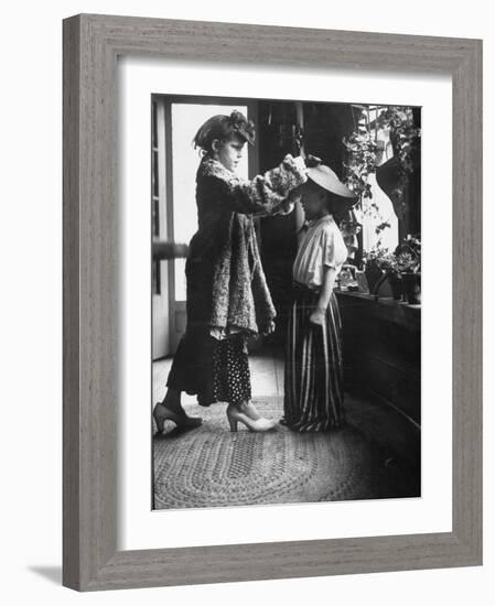 Children Trying on Old Clothes in the Attic, but Little Boy Would Prefer to Be Playing Football-Gordon Parks-Framed Photographic Print