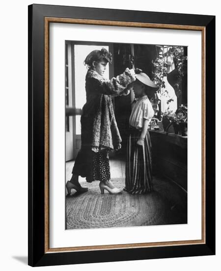 Children Trying on Old Clothes in the Attic, but Little Boy Would Prefer to Be Playing Football-Gordon Parks-Framed Photographic Print