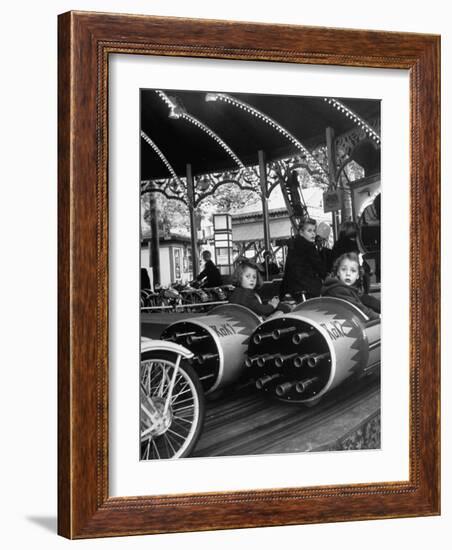 Children Waiting Expectantly For a "Rocket Ride" on the Carousel-Nina Leen-Framed Photographic Print