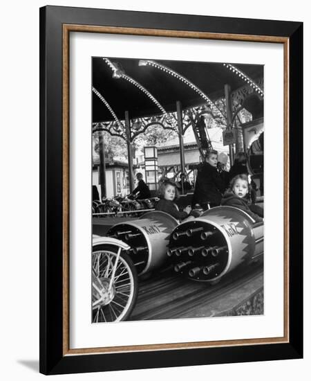 Children Waiting Expectantly For a "Rocket Ride" on the Carousel-Nina Leen-Framed Photographic Print