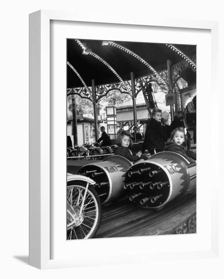 Children Waiting Expectantly For a "Rocket Ride" on the Carousel-Nina Leen-Framed Photographic Print