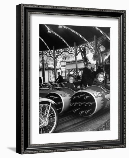 Children Waiting Expectantly For a "Rocket Ride" on the Carousel-Nina Leen-Framed Photographic Print