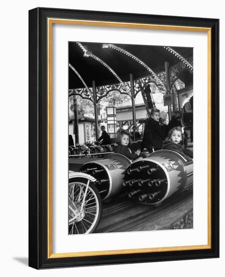 Children Waiting Expectantly For a "Rocket Ride" on the Carousel-Nina Leen-Framed Photographic Print