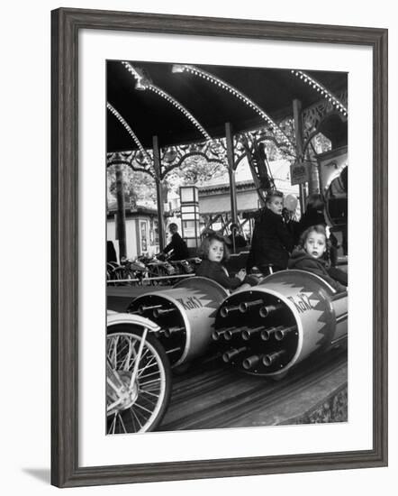 Children Waiting Expectantly For a "Rocket Ride" on the Carousel-Nina Leen-Framed Photographic Print