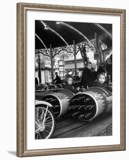 Children Waiting Expectantly For a "Rocket Ride" on the Carousel-Nina Leen-Framed Photographic Print