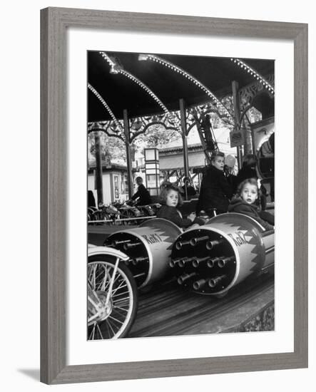 Children Waiting Expectantly For a "Rocket Ride" on the Carousel-Nina Leen-Framed Photographic Print