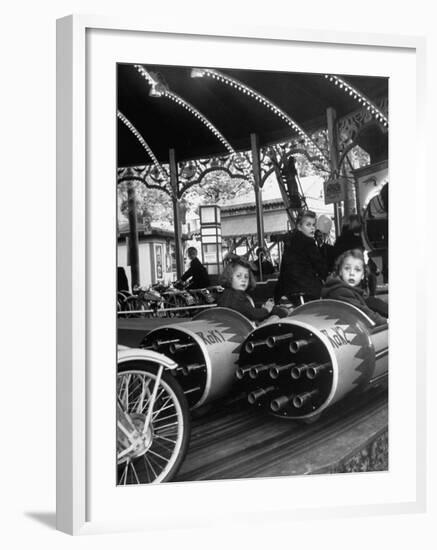 Children Waiting Expectantly For a "Rocket Ride" on the Carousel-Nina Leen-Framed Photographic Print