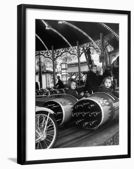Children Waiting Expectantly For a "Rocket Ride" on the Carousel-Nina Leen-Framed Photographic Print