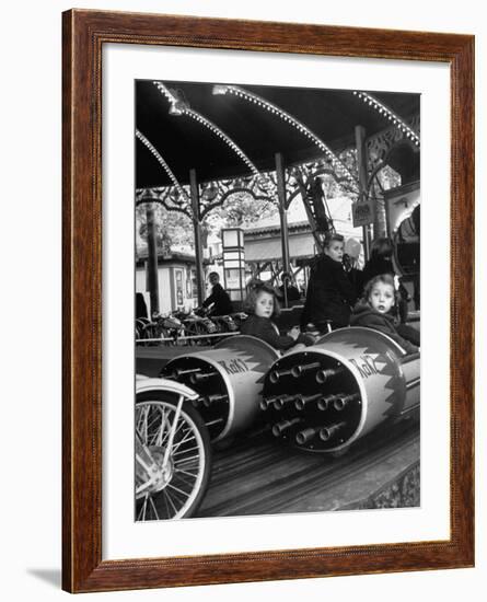 Children Waiting Expectantly For a "Rocket Ride" on the Carousel-Nina Leen-Framed Photographic Print