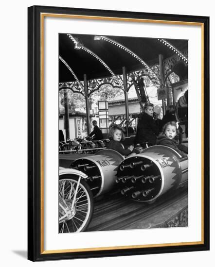 Children Waiting Expectantly For a "Rocket Ride" on the Carousel-Nina Leen-Framed Photographic Print