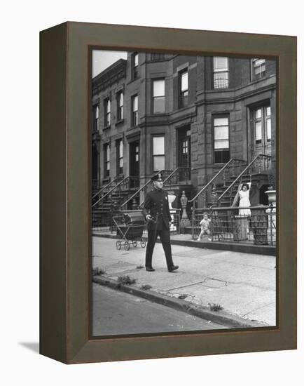 Children Watching a Policeman Walk His Beat in Front of Apartment Buildings-Ed Clark-Framed Premier Image Canvas