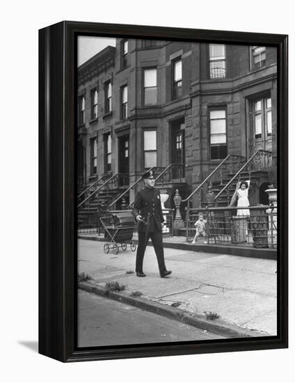 Children Watching a Policeman Walk His Beat in Front of Apartment Buildings-Ed Clark-Framed Premier Image Canvas